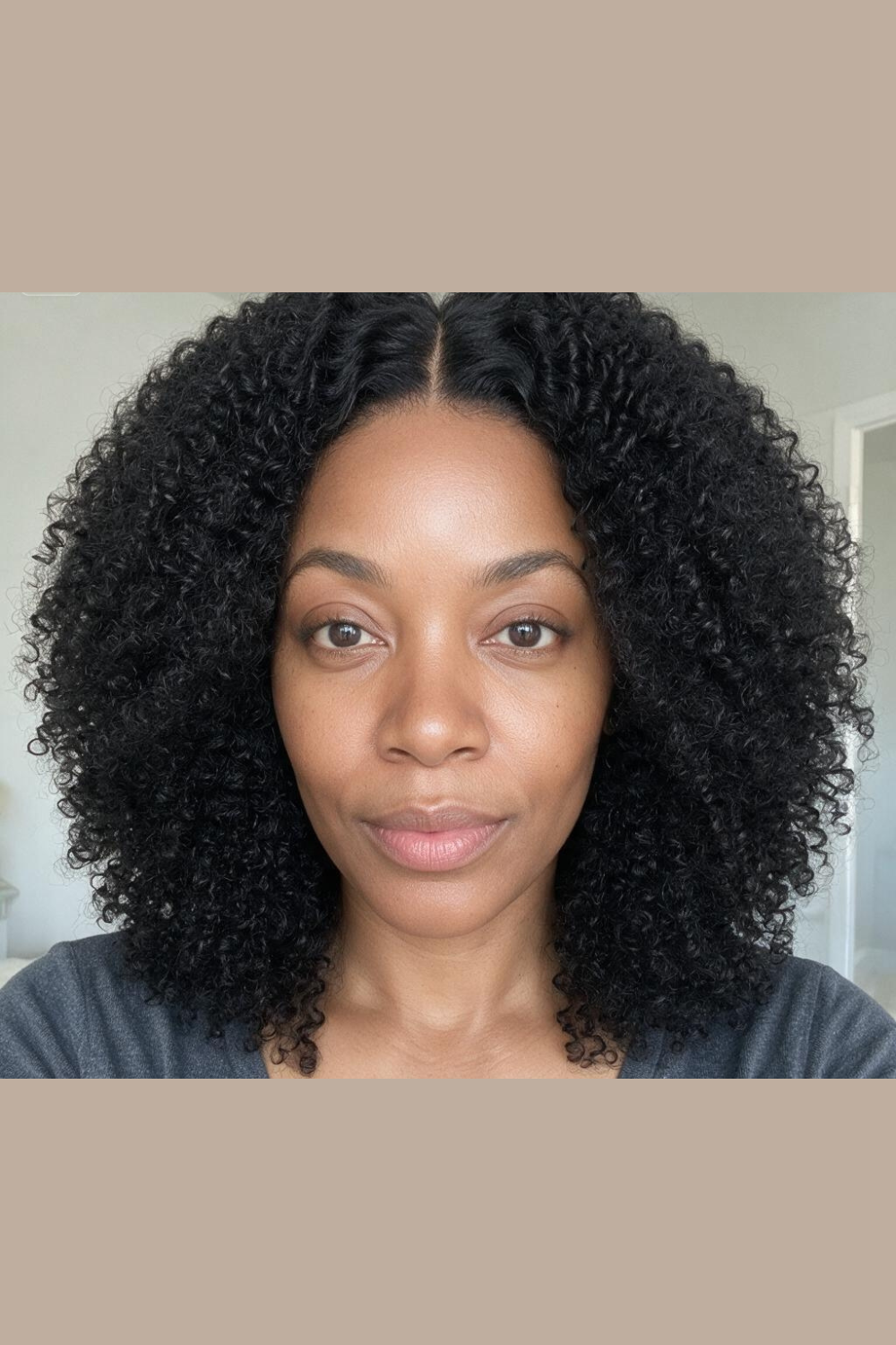 Model wearing the Jada 4x4 HD lace closure kinky curly wig in natural black