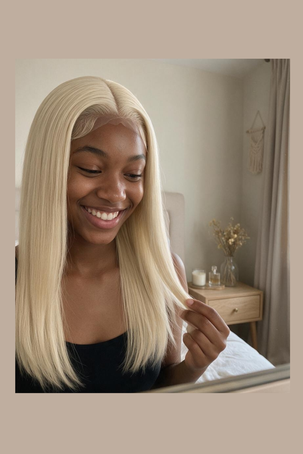 Selene 613 blonde straight wig held to show the hair's shine and blunt ends